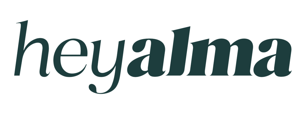The word heyalma appears in a bold, dark green serif font on a soft light background, reflecting a modern Jewish aesthetic.