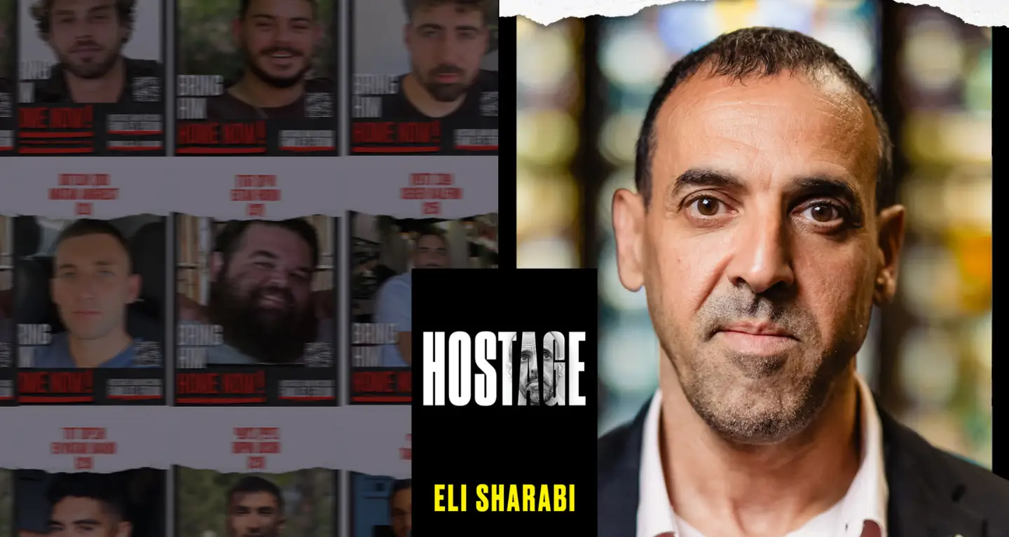 A man looks at the camera, with the text "Hostage Eli Sharabi" beside his portrait, highlighting a call for his safe return.