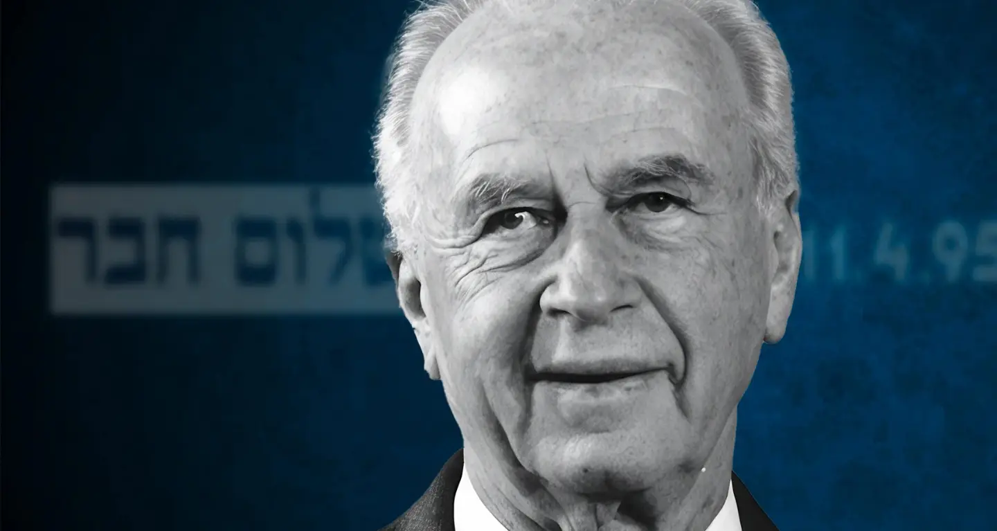 Elderly man in a suit smiling warmly, blue background with softly blurred Hebrew text, suitable for Temple Emanu-El, NYC.