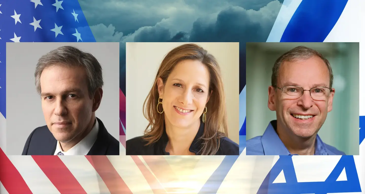 Three people stand together before a backdrop combining American and Israeli flags beneath a cloudy sky at Temple Emanu-El.