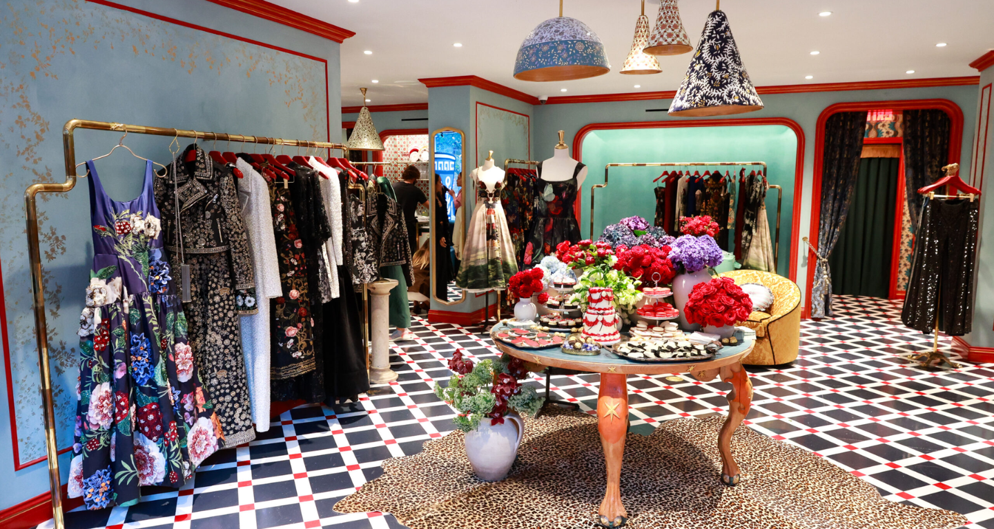 Elegant temple gift shop featuring Judaica items, floral displays, and tasteful decor on a checkered floor.