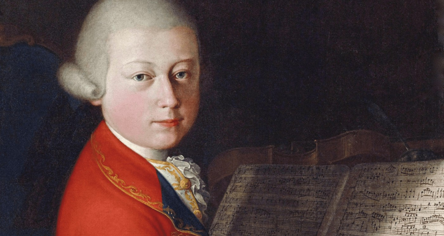Portrait of a young man in 18th-century attire seated at a piano with sheet music, reflecting musical heritage and tradition.