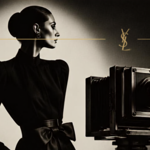 A woman in a modest dark dress stands beside a vintage camera, with an elegant background featuring soft, dramatic lighting.
