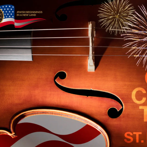 Close-up of a violin with American flag, celebratory fireworks, and “Orchestra of St. Luke’s” in orange text, designed for Temple Emanu-El in New York City.