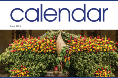 Large arrangement of colorful flowers and greenery in a decorative display beneath calendar text for Fall 2026, celebrating the season at Temple Emanu-El, a Reform Jewish synagogue in New York City.