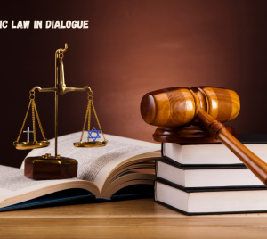 A gavel, balanced scales featuring a Star of David and a cross, and law books, with text above: Jewish & Catholic Law in Dialogue.