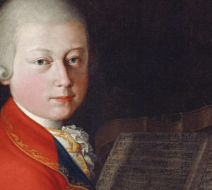 Portrait of a young man in 18th-century attire seated at a piano with sheet music, reflecting musical heritage and tradition.