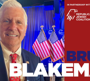 Smiling man in a suit stands in front of U.S. flags, with text on the image stating Bruce Blakeman and Republican Jewish Coalition.